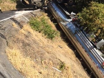 An overturned gasoline tanker ​closed Lucas Valley Road​ Sunday in Marin County.