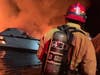 Five people were rescued and 34 were missing after a boat caught fire Monday morning near Santa Cruz Island in California, authorities said.