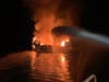 Five people were rescued and 34 were missing after a boat caught fire Monday morning near Santa Cruz Island in California, authorities said.
