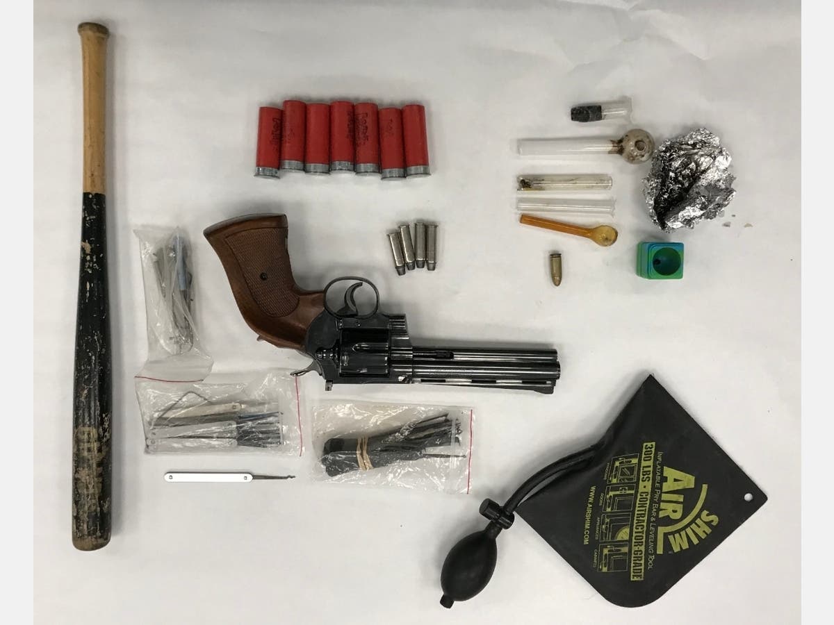 An officer and his K-9 partner​ searched the car and found a small amount of heroin, drug paraphernalia, a Colt Python .357 Magnum revolver, ammunition, burglary tools and stolen identification cards, according to police.