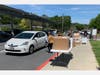 Novato High School seniors picked up their signs while driving through the school parking lot.