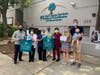 Assemblymember Todd Gloria (left), along with St. Paul's Senior Services​ staff members and the Onken family (right) with the #sendmasksnow campaign.