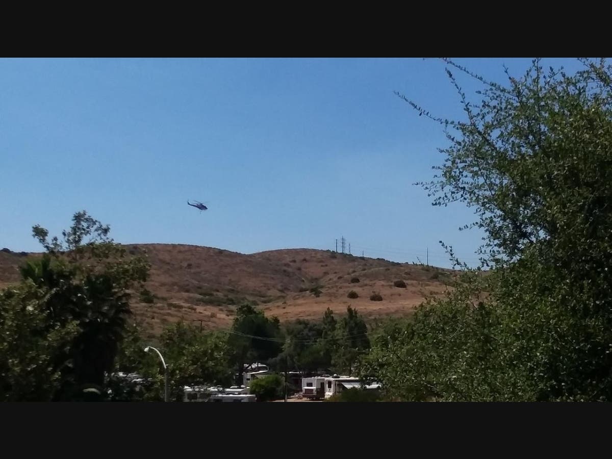 A slow-moving brush fire sparked Thursday afternoon near Sycamore Landfill.