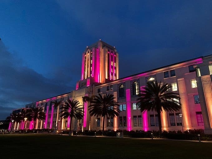 The San Diego County Administration Center lit up in crimson red and gold Monday night to honor George Floyd.