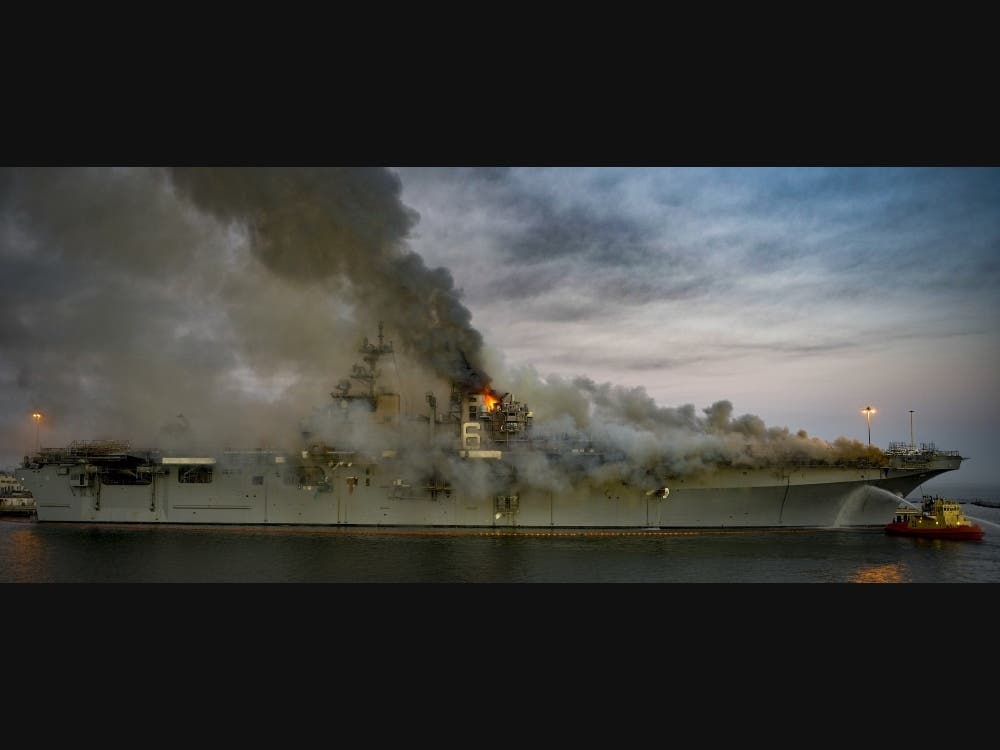 A fire that sparked Sunday morning on USS Bonhomme Richard at Naval Base San Diego continued to burn Monday.