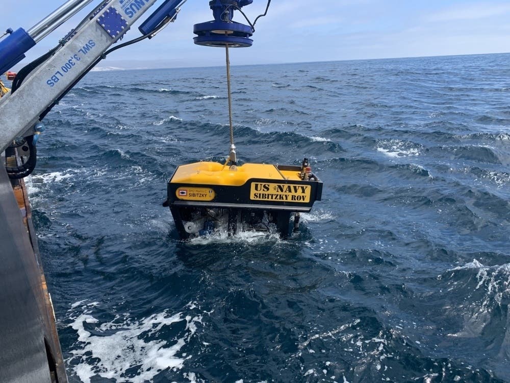 Undersea Rescue Command deploys the Sibitzky Remotely Operated Vehicle (ROV) from the deck of the Military Sealift Command-chartered merchant vessel HOS Dominator. 