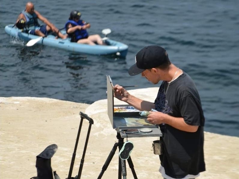 A painter at La Jolla Cove
