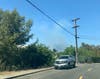 Smoke from the fire was visible from nearby communities.