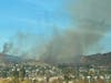 The blaze sparked in vegetation near Cuyamaca Street and Chaparral Drive.