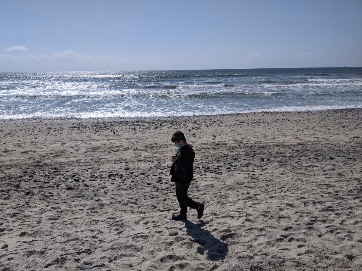 Judy McCoy's son walking on South Carlsbad State Beach​.