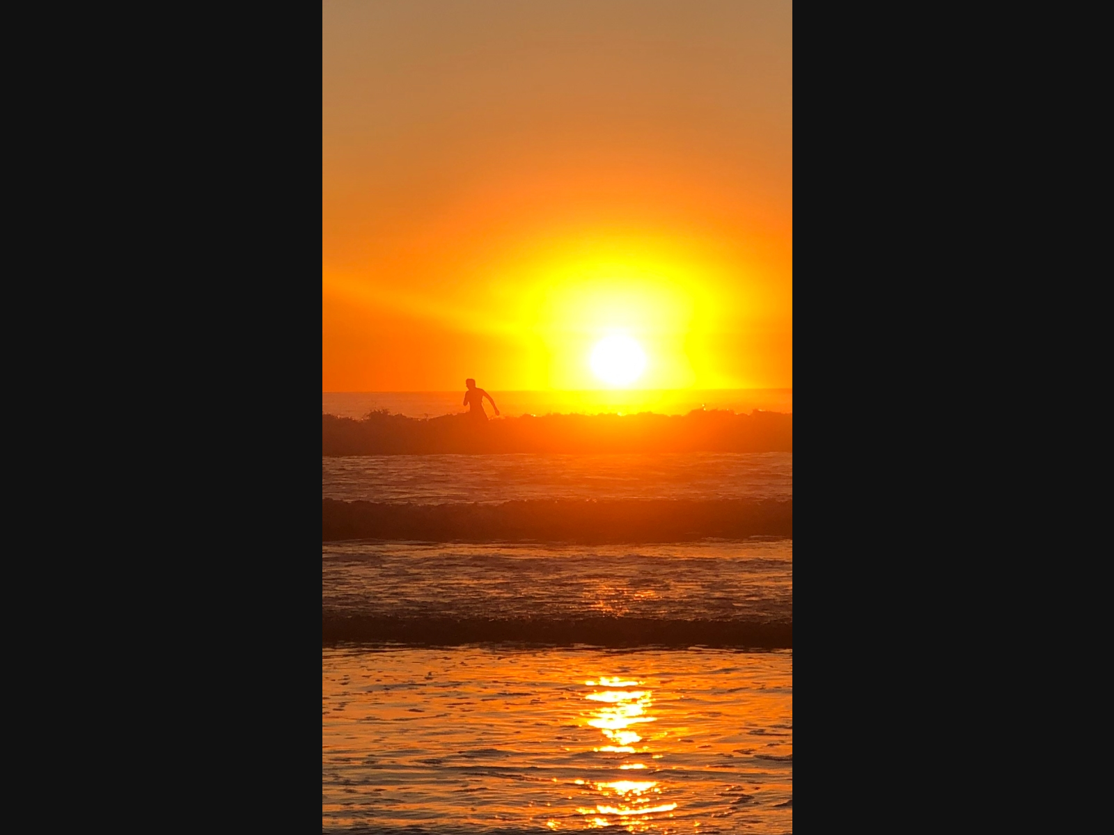 A surfer in Carlsbad, California