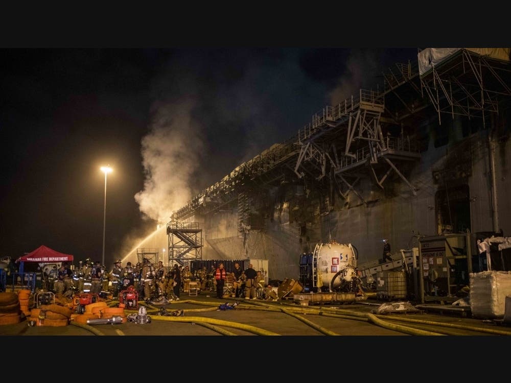 Sailors combat a fire aboard the amphibious assault ship USS Bonhomme Richard (LHD 6) on July 13, 2020, in San Diego, California. 