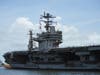 U.S. sailors man the rails aboard the aircraft carrier USS Abraham Lincoln (CVN 72) as it arrives for a scheduled port visit at Naval Station Mayport, Florida, Aug. 4, 2012.