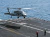 An MH-60S Knighthawk helicopter, assigned to the ìDusty Dogsî of Helicopter Sea Combat Squadron 7, lands on the flight deck of the aircraft carrier USS Harry S. Truman (CVN 75) March 6, 2014.