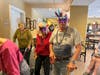 Felicita Vida residents participate in a Mardi Gras parade.