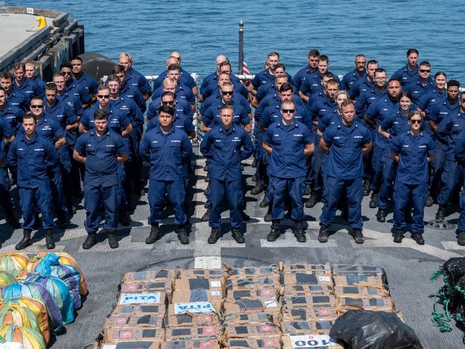 Crew members from the U.S. Coast Guard Cutter Steadfast (WMEC 623) stand on the flight deck of the cutter as they prepare to offload in San Diego.