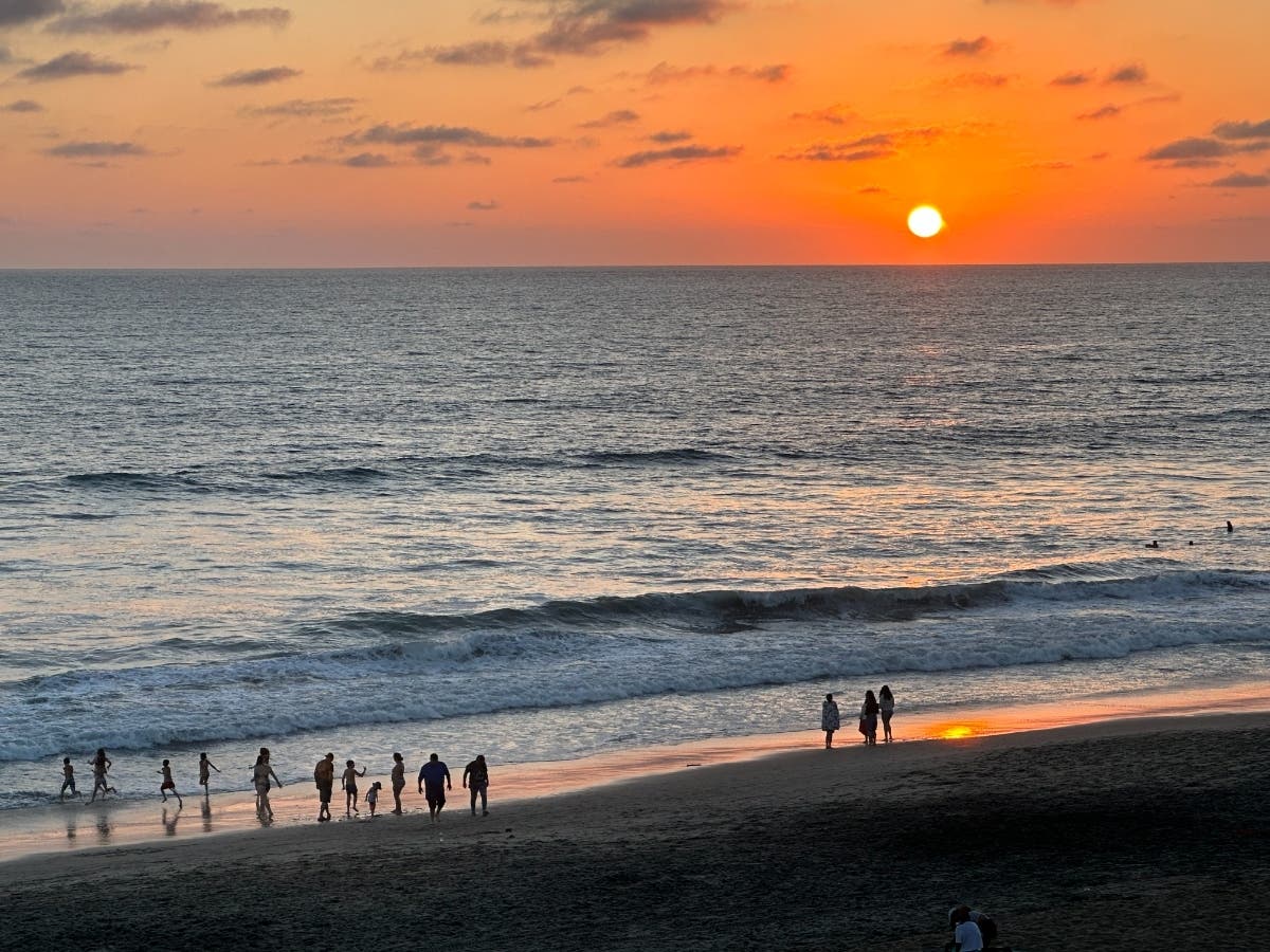 Beachgoers at Robert C. Frazee State Beach in Carlsbad, California. 