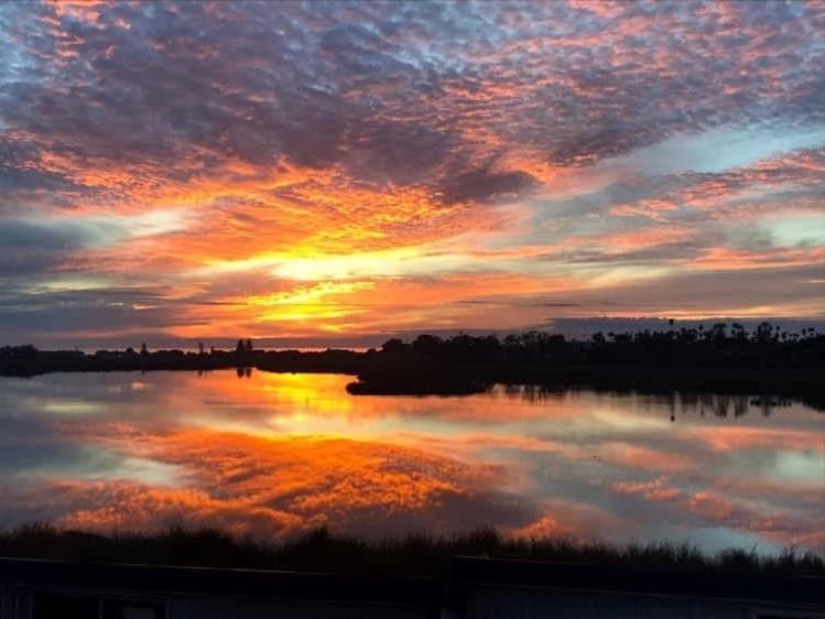The sun sets over Buena Vista Lagoon.