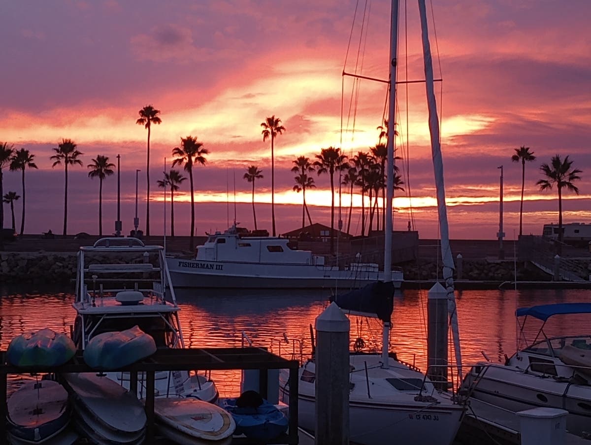 The sun sets over Oceanside Harbor.