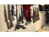 During a search of the home, deputies found a stash of weapons including rifles, shotguns and handguns, as well as hundreds of rounds of ammunition and tactical vests.