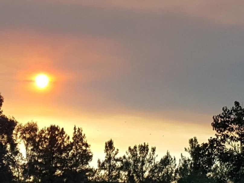 The air district advised residents to stay inside with windows and doors closed if it smells smoky outside. 