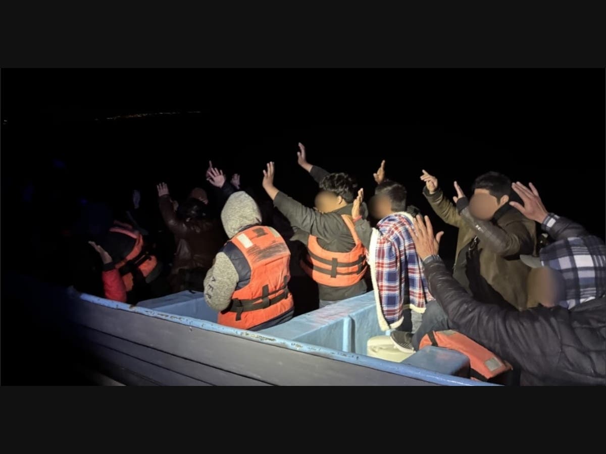The boarding team stopped the vessel and identified 20 suspected undocumented migrants on board.