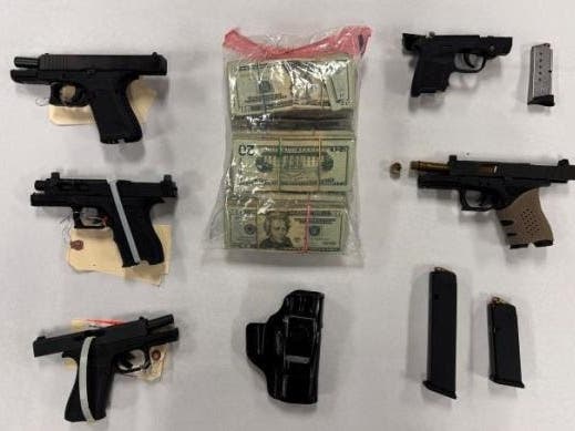 Investigators recovered five firearms and $20,000 in cash during the operation, sheriff's officials said.