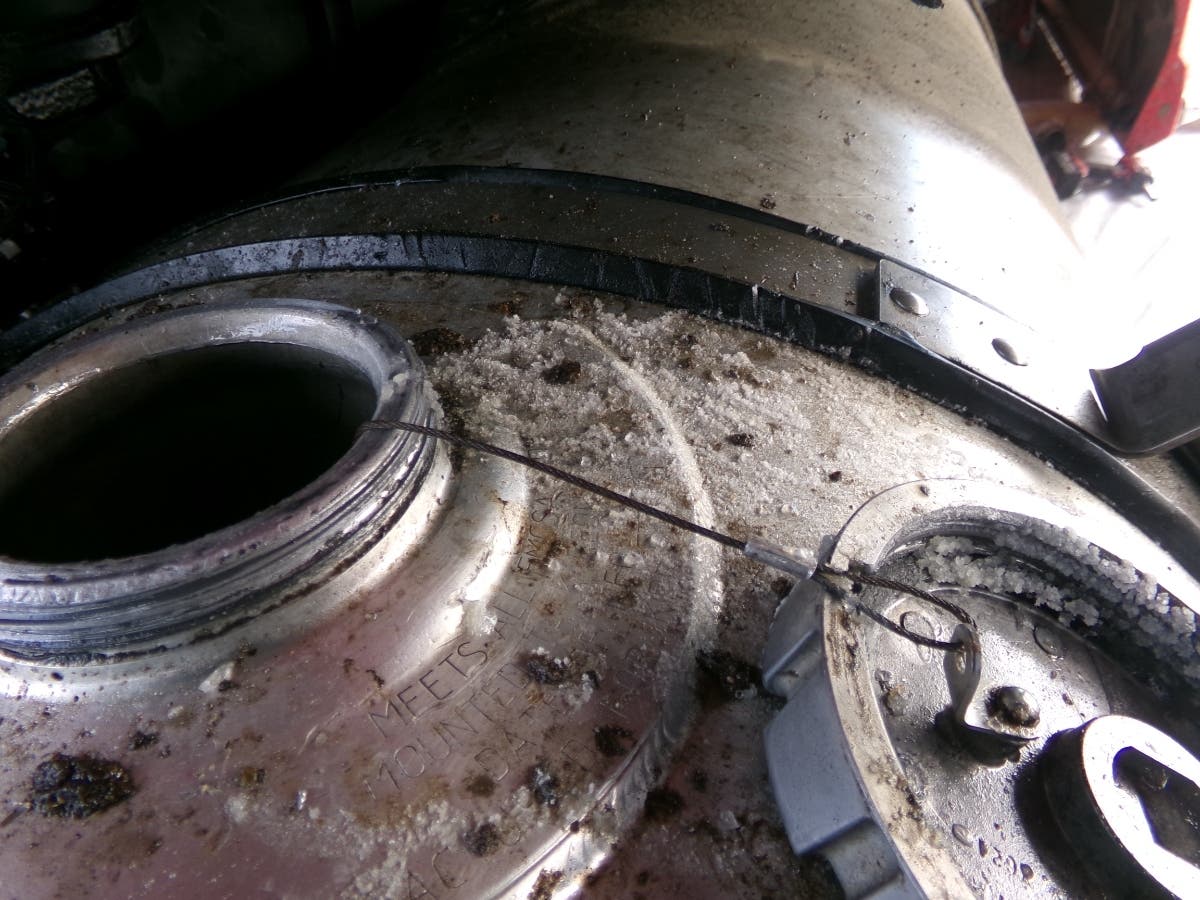 Authorities seized nearly half a ton of liquid methamphetamine that was concealed inside the fuel tank of a commercial tractor-trailer at the U.S.-Mexico border. This picture shows white crystalline substance across the fuel tank.