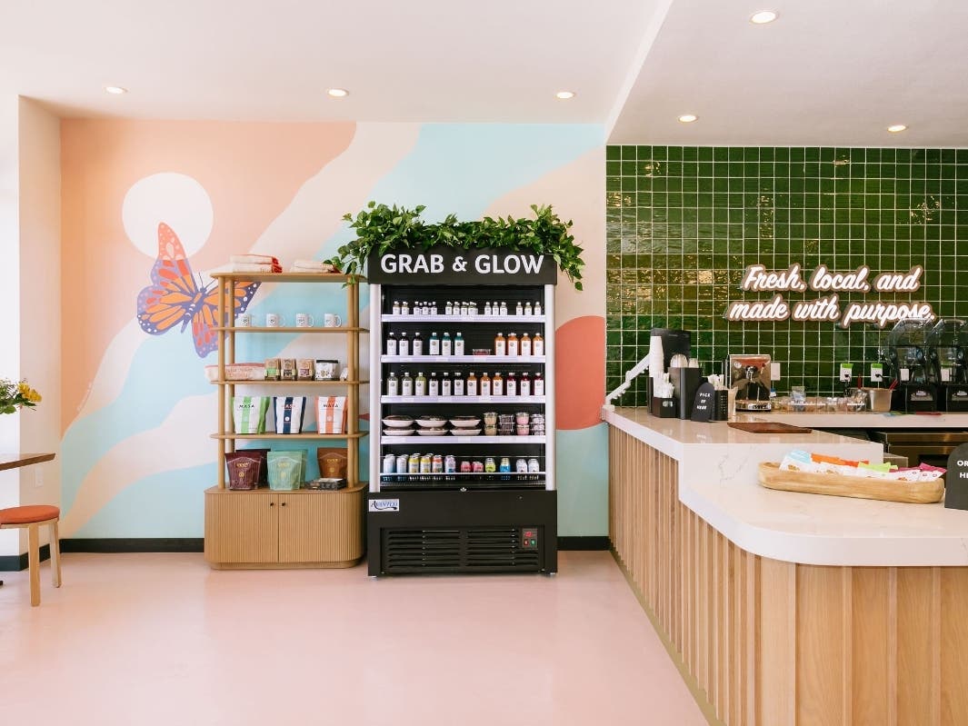 The café features cold-pressed juices, smoothies, lattes, wellness shots, and grab-and-go foods made with organic, all-natural ingredients.
