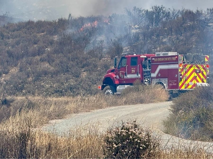 Crews worked overnight in steep, rocky terrain with support from a Cal Fire Hawk helicopter assigned to nighttime suppression efforts.