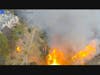 The fire threatened homes and prompted evacuations.