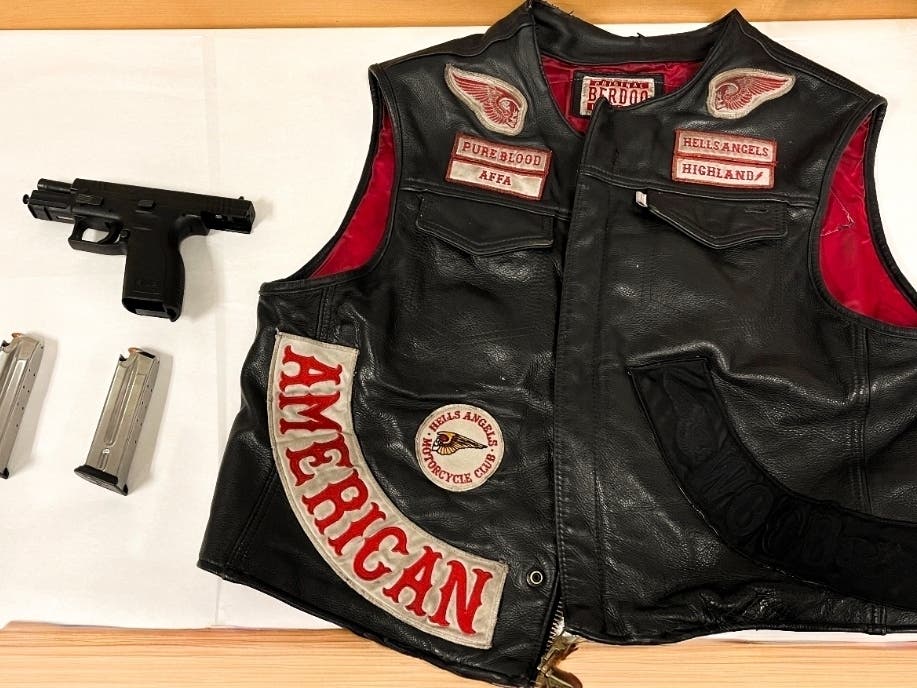 Officers seized 14 firearms and reported finding loaded guns, knives, hammers and other weapons in the possession of some riders.