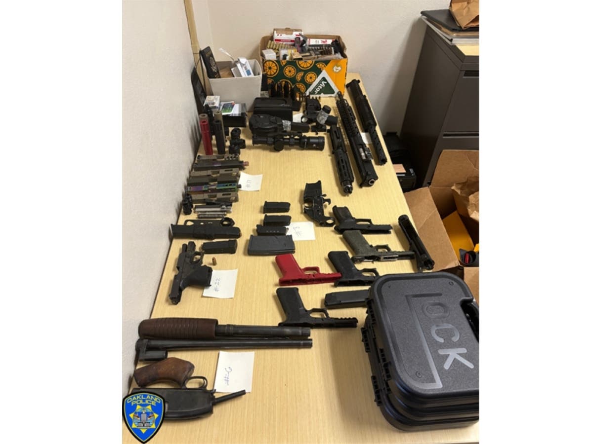 A tip to the Oakland Police Department's drug hotline led to the arrest of an alleged Bay Area firearm trafficker and the seizure of firearms, narcotics, and equipment used to manufacture privately made guns known as ghost guns, police said.