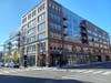 Street view of ‘Flats on First’, the mixed-use complex featuring 136 apartments and 15,800 square feet of retail space, opposite Cambridgeside