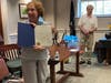 Leslee Willitts displays the Board of Selectmen certificate of appreciation as Selectman Osler "Pete" Peterson looks on.