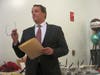 Mike Marcucci, Chair of Medfield Board of Selectmen, reads a proclamation honoring Paul Hinkley.