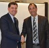 Michael F. Rich III, NSWCA President and Oyster Bay Water District Commissioner (Left), congratulates Bill Merklin.