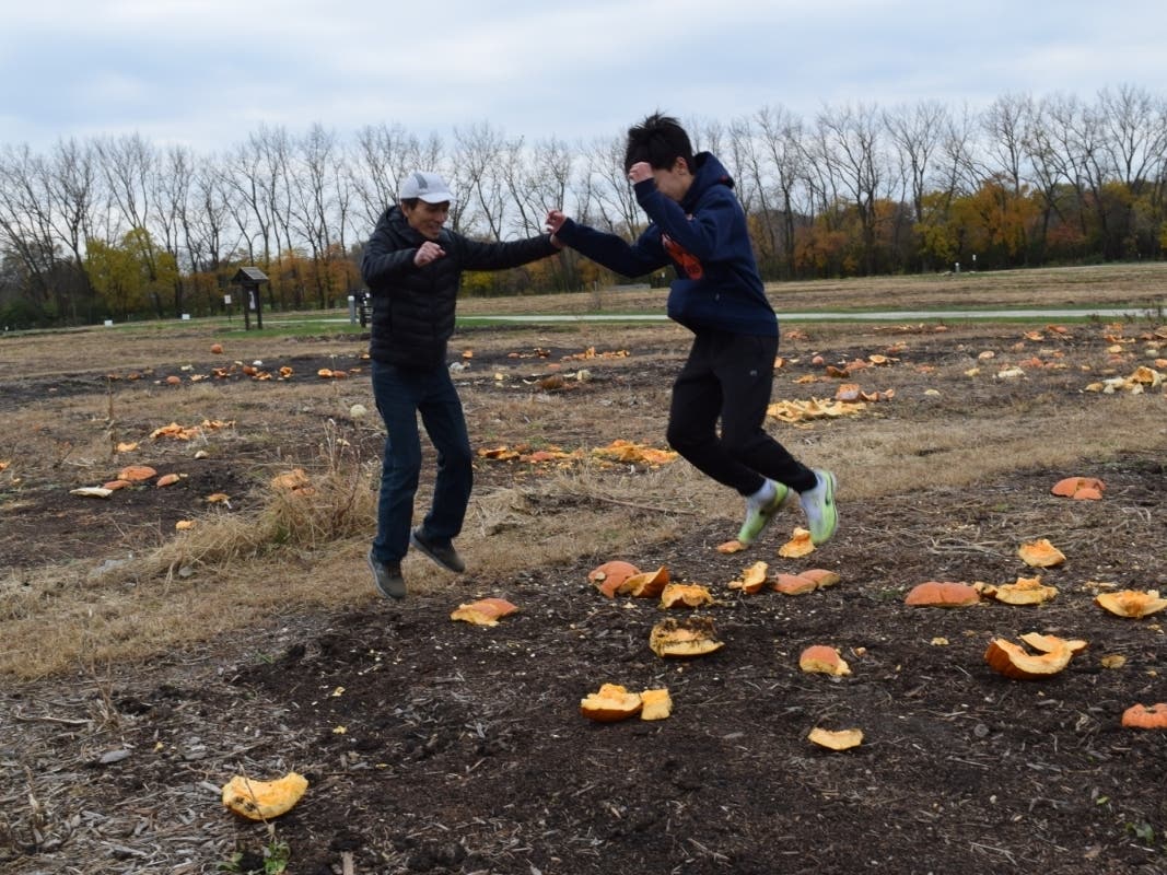 Smashing pumpkins at the Garden Plots, Nov. 2018