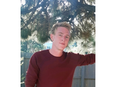 Spencer Erickson, pictured before he was attacked by a Lakewood police dog, is suing the city and several police officers.