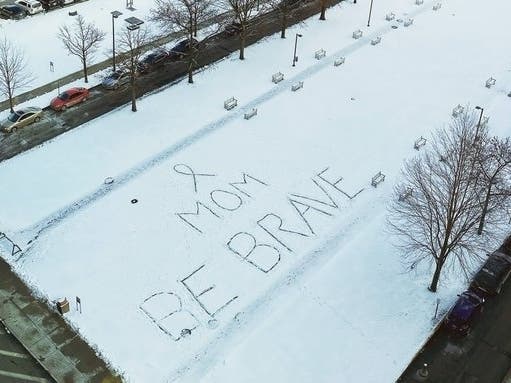 The visitor's message was drawn in the snow on the yard of the Cleveland Clinic's main campus.