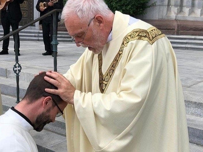 Edmond Ilg was among 10 newly ordained priests at a ceremony in Newark. His first blessing was for his son, Phillip, who is also a priest.