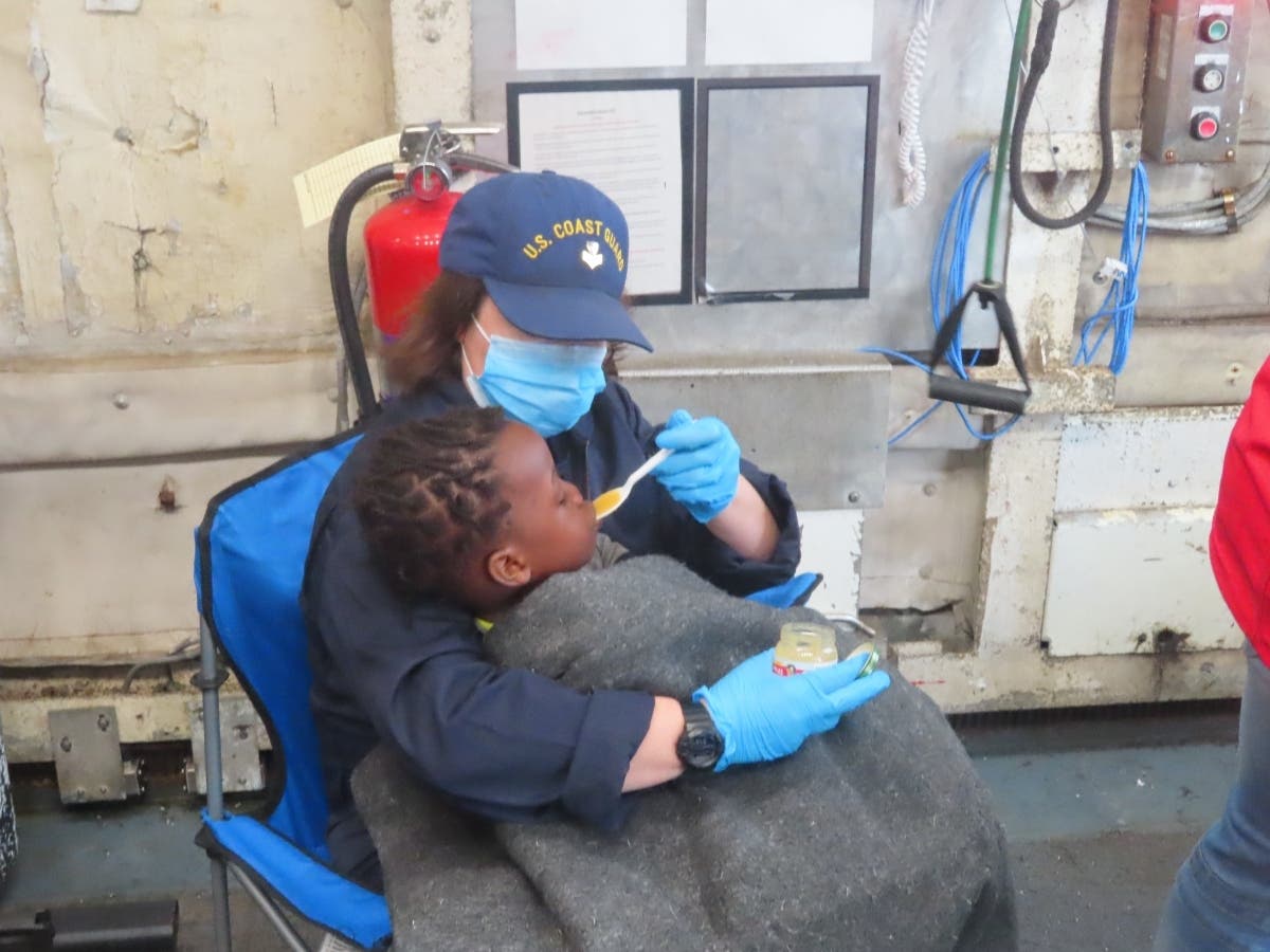 More than 100 migrants were rescued from an overloaded sailboat Monday after the vessel hit a sandbar near Whale Harbor.