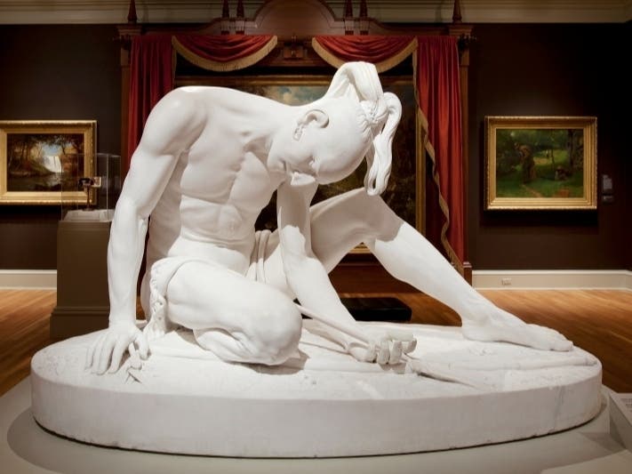 A Virginia art museum agreed to return a life-size statue of a wounded Indigenous warrior to a Boston organization following a decades-long dispute and an investigation by the FBI.