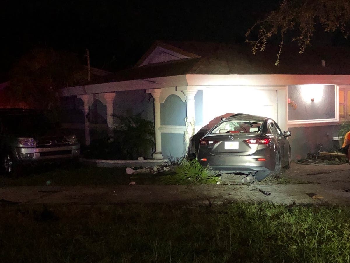 A two-car crash in Clearwater on Friday morning ended with one of the vehicles inside of a home, according to police.