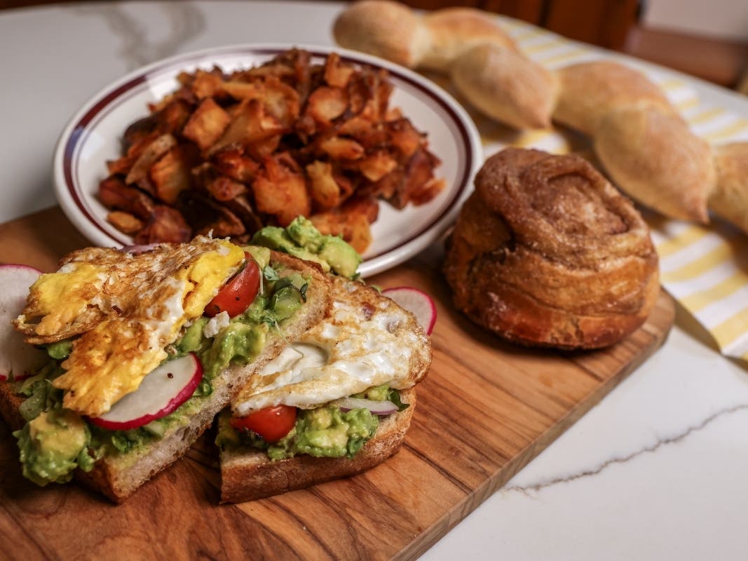 Best Buns Bakery & Burgers opened its newest Northern Virginia location on Thursday, bringing an all-day restaurant, bakery and rooftop bar to the West Falls development.