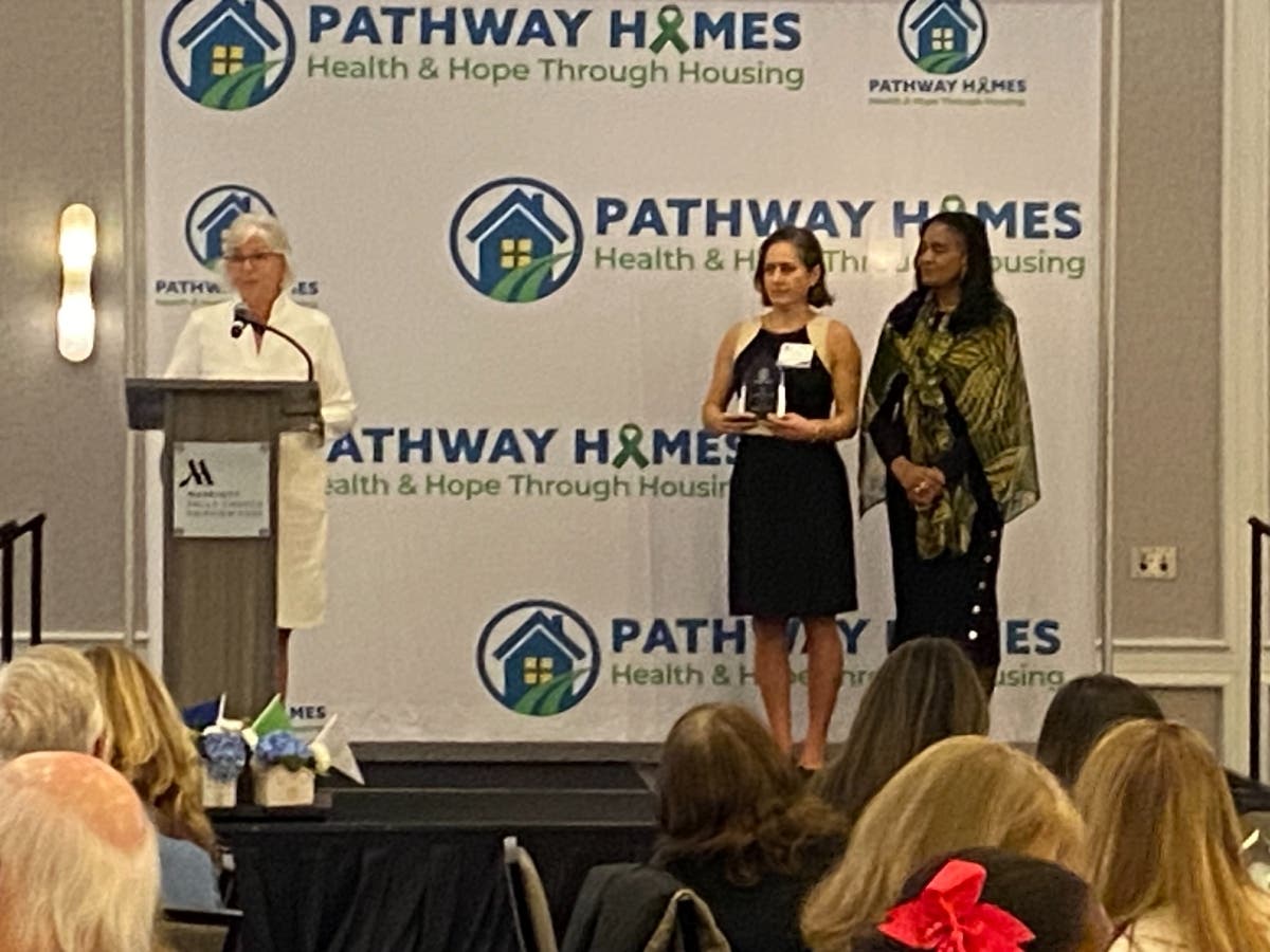 Retired Cornerstones CEO Kerrie Wilson accepts an award from Pathway Board Member Zoila Hinson and Pathway CEO Sylisa Lambert-Woodward at a recent fundraiser in Fairfax.