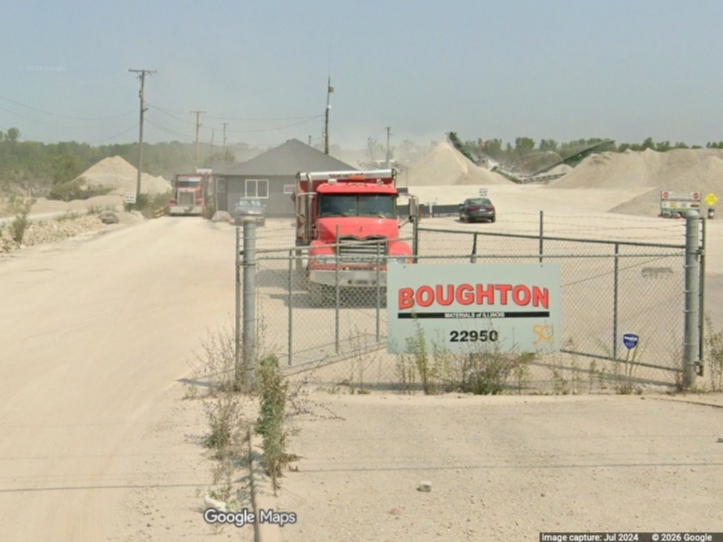 A dump truck driver was killed Friday  when a large truck overturned at a rock quarry in unincorporated Plainfield.