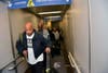 Law enforcement officials provided an airport escort for the duo accused of murder, then blaming it on a panhandler.