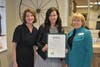 Owners Maureen Bruneau and Beth Pocalyko pose with Mayor Susan Burdette.