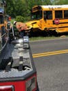 There were five people aboard the school bus, including four students, officials said.